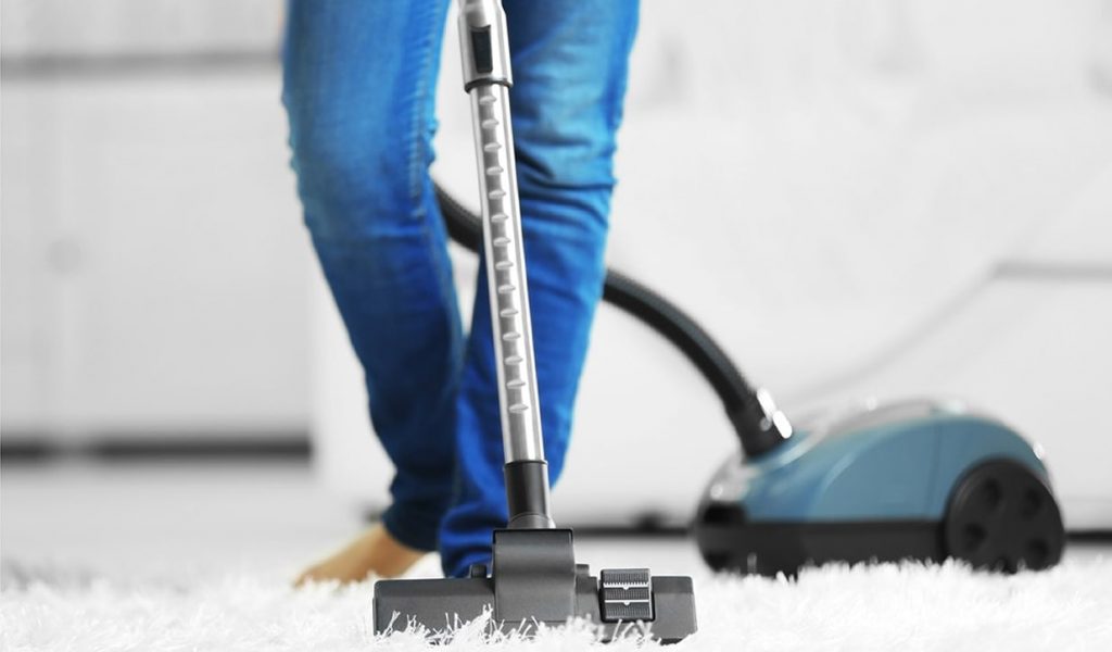 Carpet vacuuming at home for dust removal